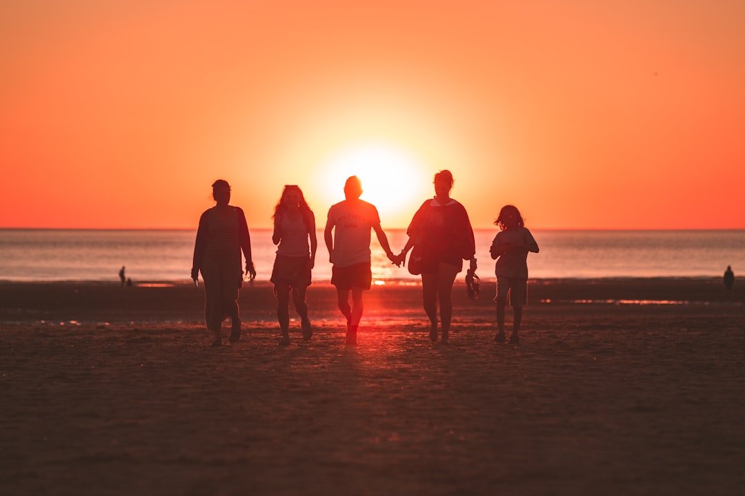 About I was randomly shooting the sunset when a family decided to walk back from the sea to the beach, I was just perfectly aligned with them and the golden hour sun. Captured the cute moment where the mother and father were holding hands. They noticed me afterwards and they asked if I had an instagram so they could see my work. We had a little chat and I showed the fresh photo directly on my camera screen, they were really happy with it !
I love the tones and how the backlight enhances group.